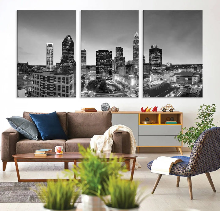 The "Charlotte City Cloudy Skyline Black and White Wall Art Cityscape Canvas Print" hangs on a dark wall, showcasing its UV-protective properties for enduring beauty.