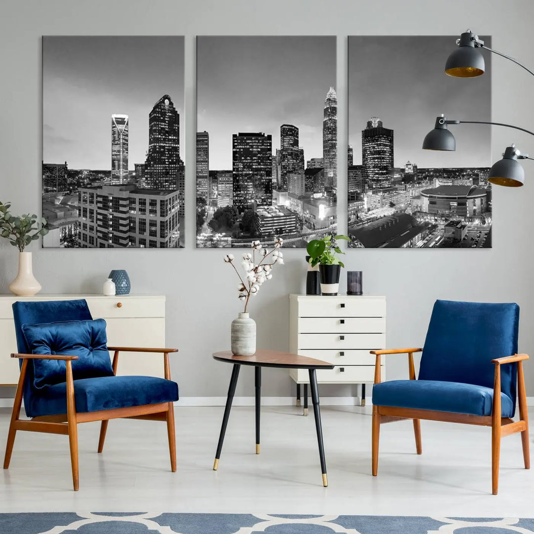 The "Charlotte City Cloudy Skyline Black and White Wall Art Cityscape Canvas Print" hangs on a dark wall, showcasing its UV-protective properties for enduring beauty.