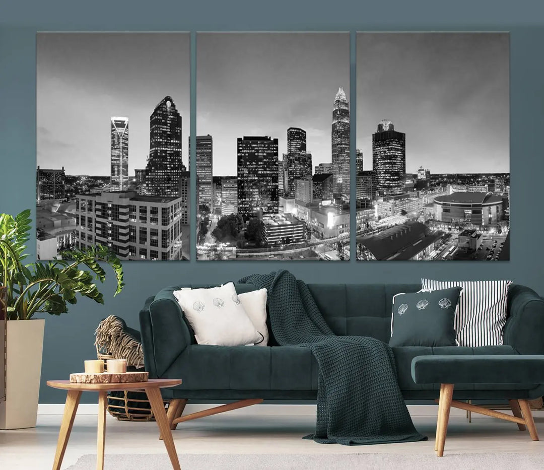 The "Charlotte City Cloudy Skyline Black and White Wall Art Cityscape Canvas Print" hangs on a dark wall, showcasing its UV-protective properties for enduring beauty.