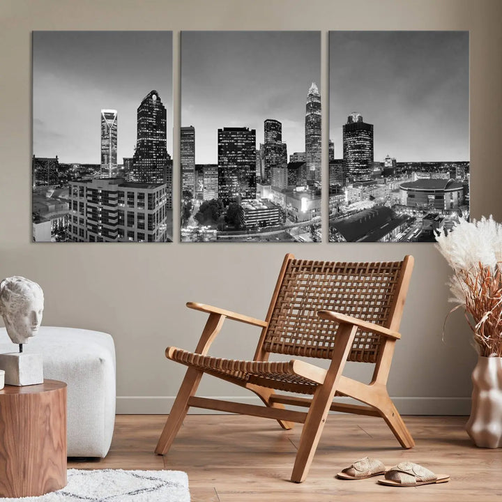 The "Charlotte City Cloudy Skyline Black and White Wall Art Cityscape Canvas Print" hangs on a dark wall, showcasing its UV-protective properties for enduring beauty.