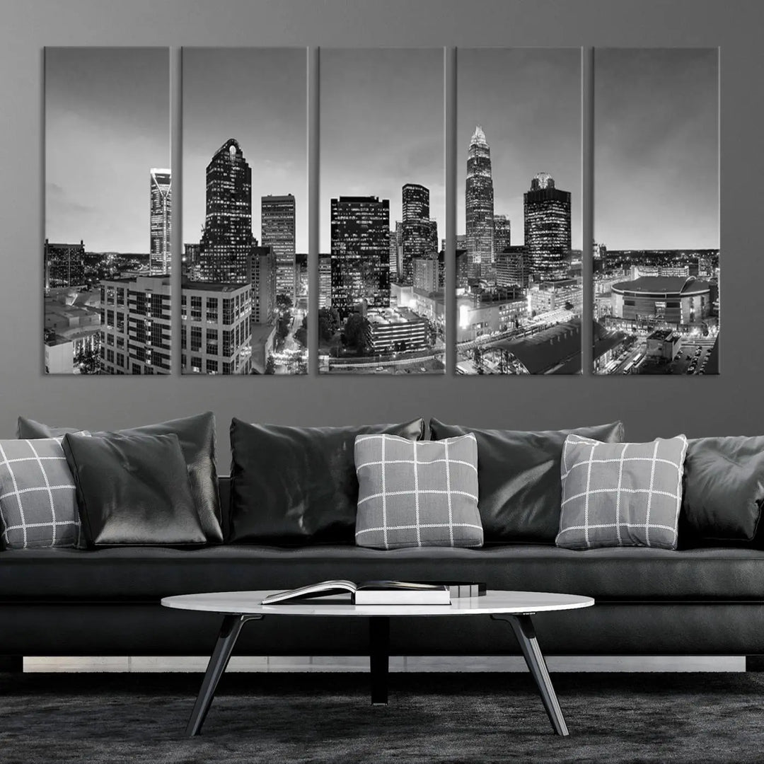 The "Charlotte City Cloudy Skyline Black and White Wall Art Cityscape Canvas Print" hangs on a dark wall, showcasing its UV-protective properties for enduring beauty.