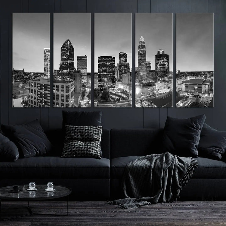 The "Charlotte City Cloudy Skyline Black and White Wall Art Cityscape Canvas Print" hangs on a dark wall, showcasing its UV-protective properties for enduring beauty.