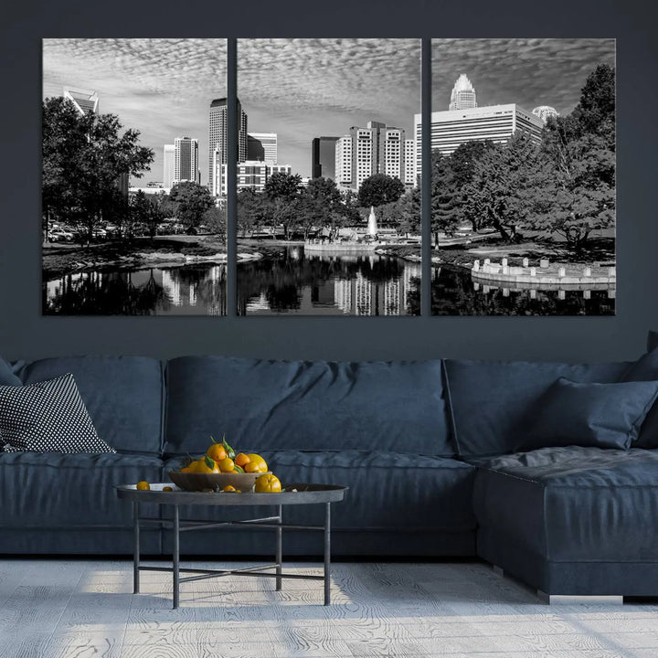 The living room features a captivating triptych titled "Charlotte City Cloudy Skyline Black and White Wall Art Cityscape Canvas Print," crafted on museum-quality canvas with UV-protective coating. Modern decor accentuates the dynamic scene.