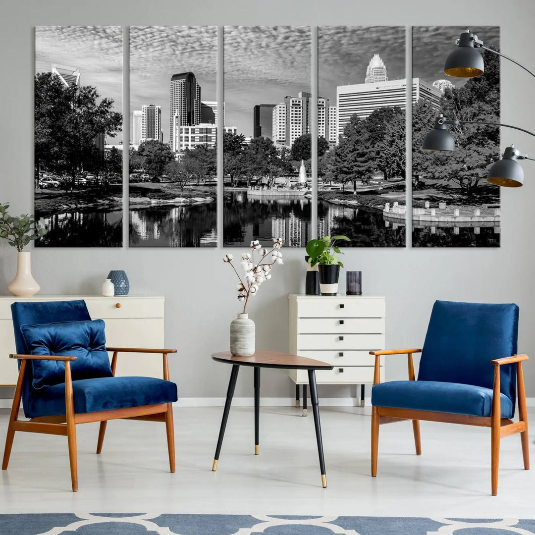 The living room features a captivating triptych titled "Charlotte City Cloudy Skyline Black and White Wall Art Cityscape Canvas Print," crafted on museum-quality canvas with UV-protective coating. Modern decor accentuates the dynamic scene.