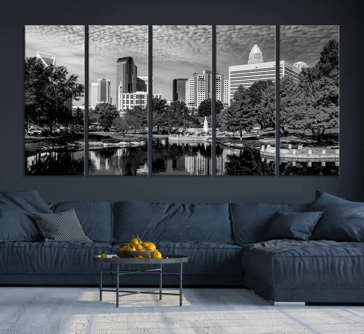 The living room features a captivating triptych titled "Charlotte City Cloudy Skyline Black and White Wall Art Cityscape Canvas Print," crafted on museum-quality canvas with UV-protective coating. Modern decor accentuates the dynamic scene.