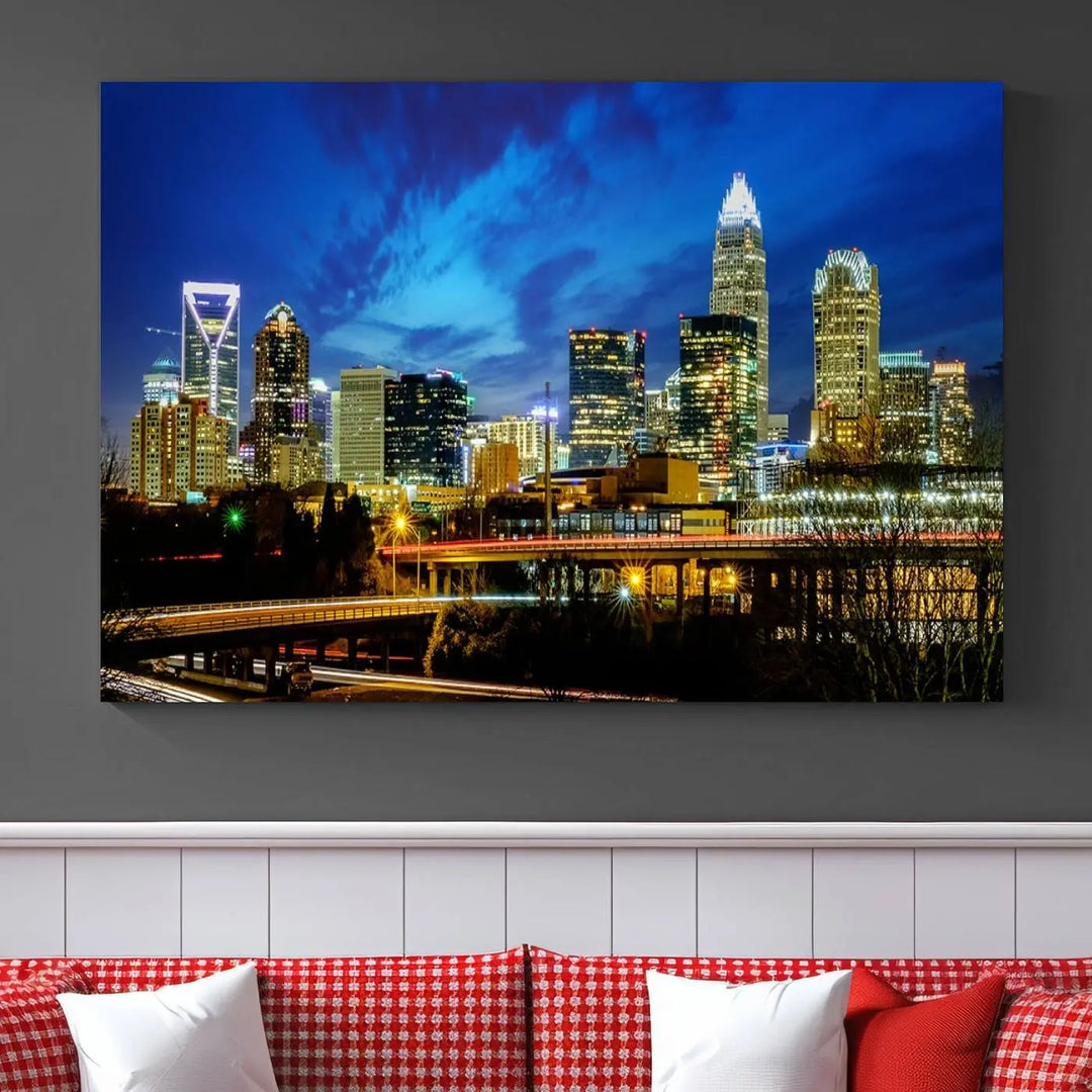 A modern living room highlighted by the "Charlotte City Lights Cloudy Blue Night Skyline Cityscape View" wall art canvas print, crafted on museum-quality canvas with UV-protective coating.