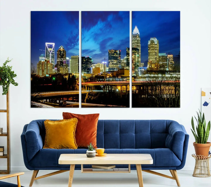 A modern living room highlighted by the "Charlotte City Lights Cloudy Blue Night Skyline Cityscape View" wall art canvas print, crafted on museum-quality canvas with UV-protective coating.