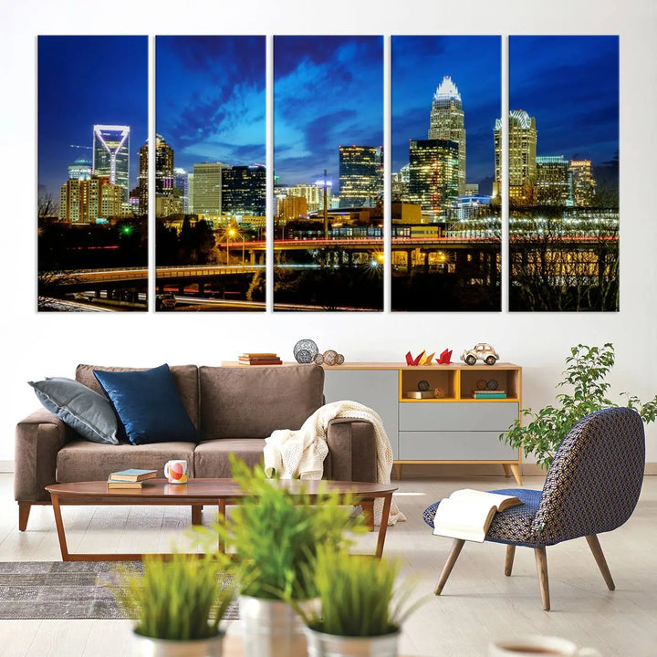 A modern living room highlighted by the "Charlotte City Lights Cloudy Blue Night Skyline Cityscape View" wall art canvas print, crafted on museum-quality canvas with UV-protective coating.