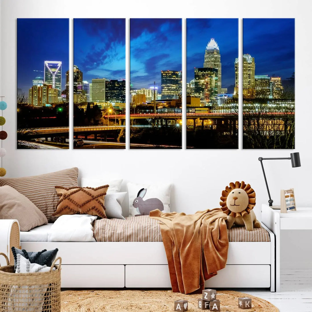 A modern living room highlighted by the "Charlotte City Lights Cloudy Blue Night Skyline Cityscape View" wall art canvas print, crafted on museum-quality canvas with UV-protective coating.