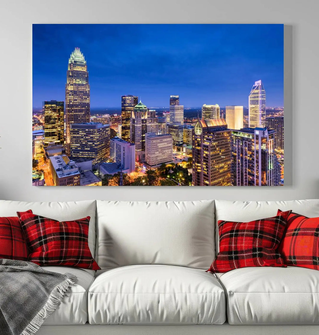 The living room features the "Charlotte City Lights Night Blue Skyline Cityscape View Wall Art Canvas Print" on museum-quality canvas with a UV-protective coating. Cozy and modern decor complements the ready-to-hang look.