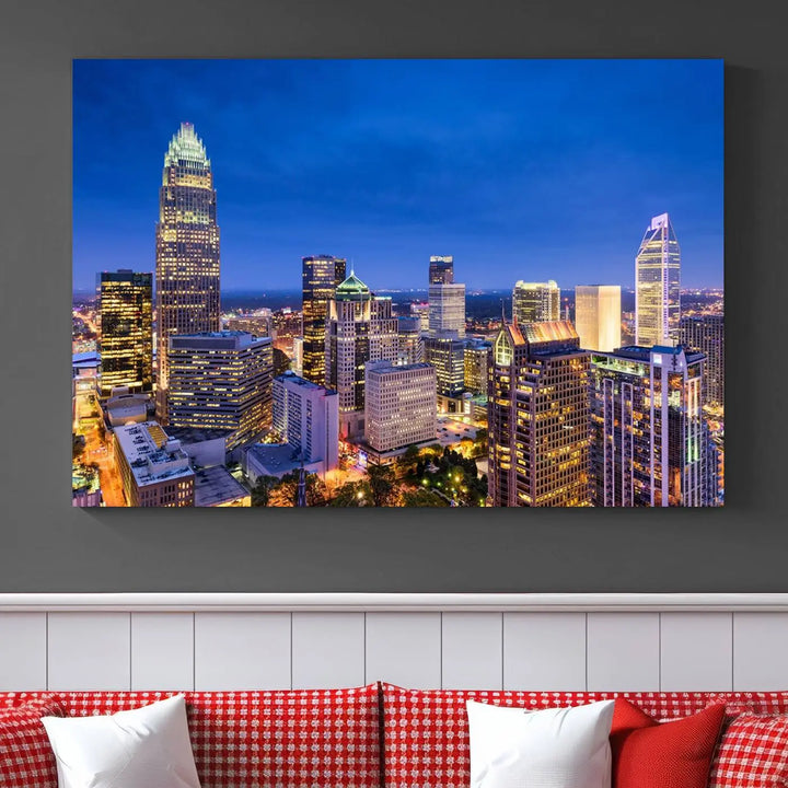 The living room features the "Charlotte City Lights Night Blue Skyline Cityscape View Wall Art Canvas Print" on museum-quality canvas with a UV-protective coating. Cozy and modern decor complements the ready-to-hang look.