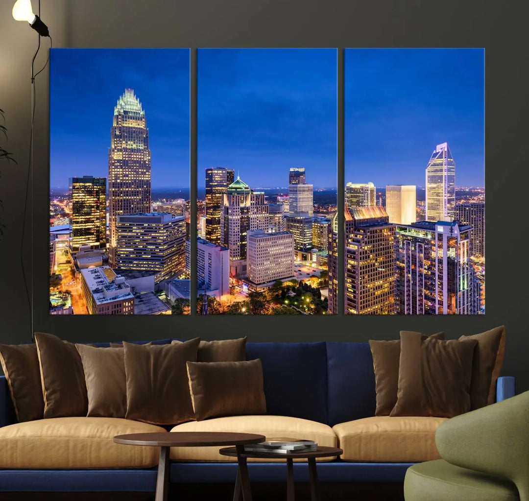 The living room features the "Charlotte City Lights Night Blue Skyline Cityscape View Wall Art Canvas Print" on museum-quality canvas with a UV-protective coating. Cozy and modern decor complements the ready-to-hang look.