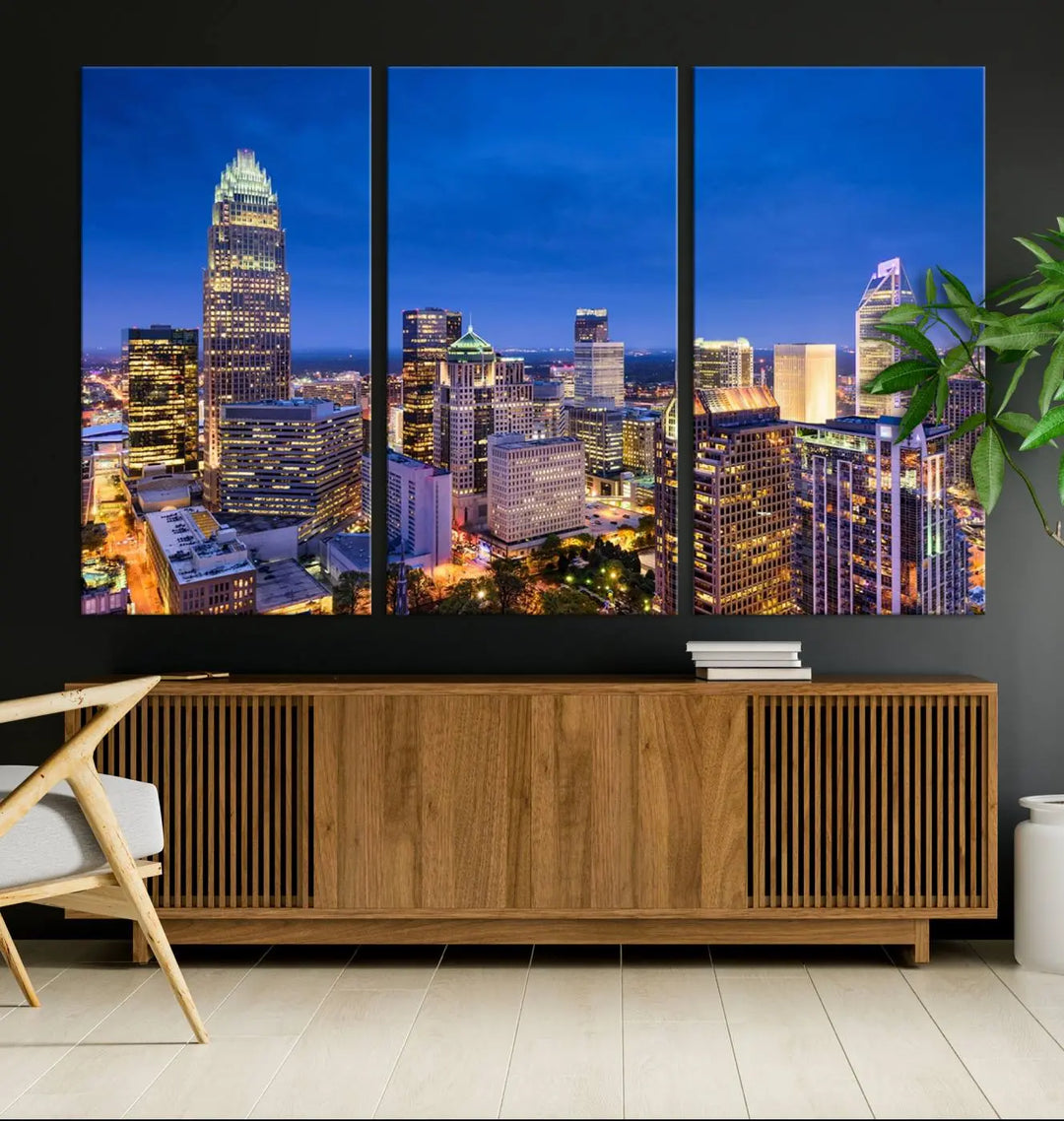 The living room features the "Charlotte City Lights Night Blue Skyline Cityscape View Wall Art Canvas Print" on museum-quality canvas with a UV-protective coating. Cozy and modern decor complements the ready-to-hang look.