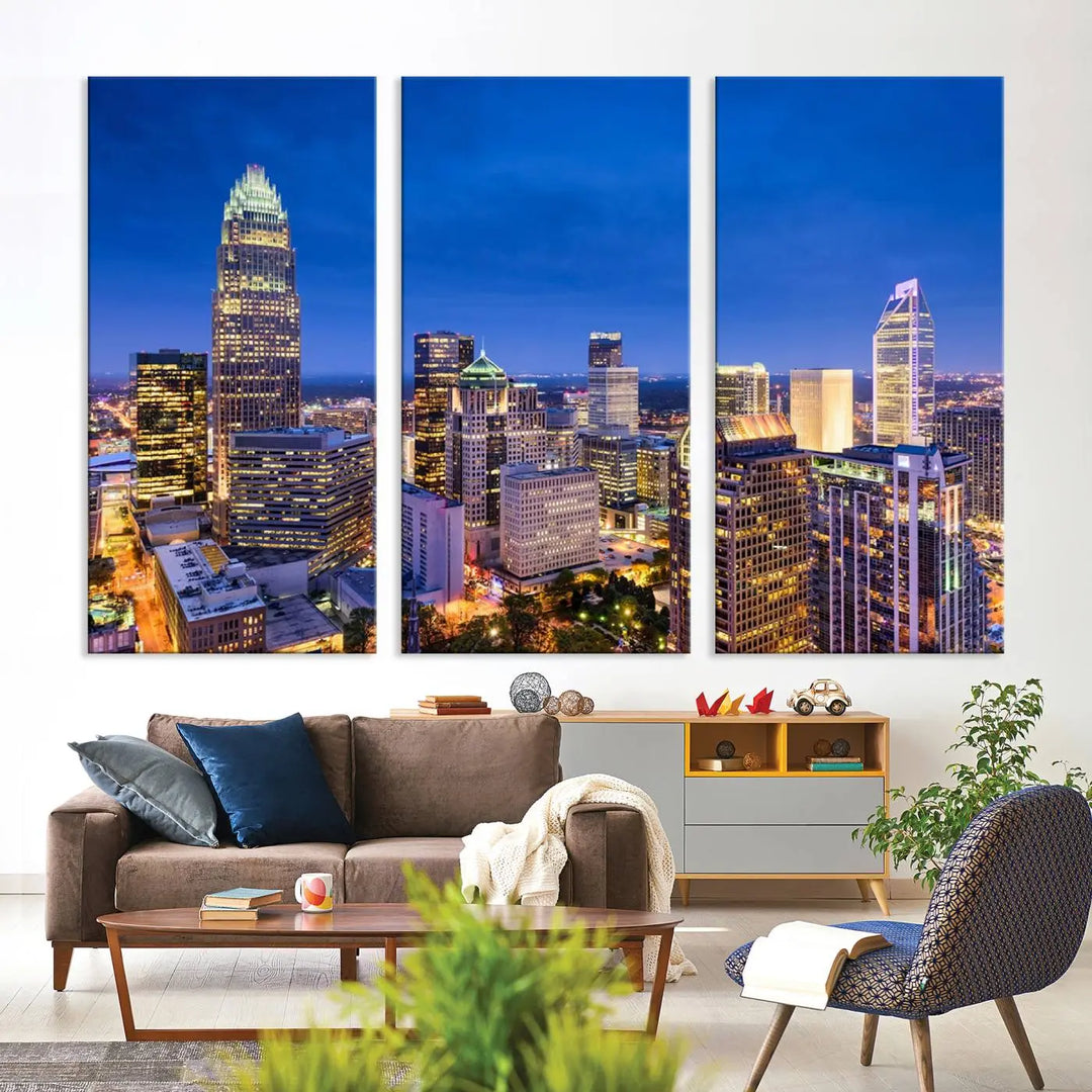 The living room features the "Charlotte City Lights Night Blue Skyline Cityscape View Wall Art Canvas Print" on museum-quality canvas with a UV-protective coating. Cozy and modern decor complements the ready-to-hang look.