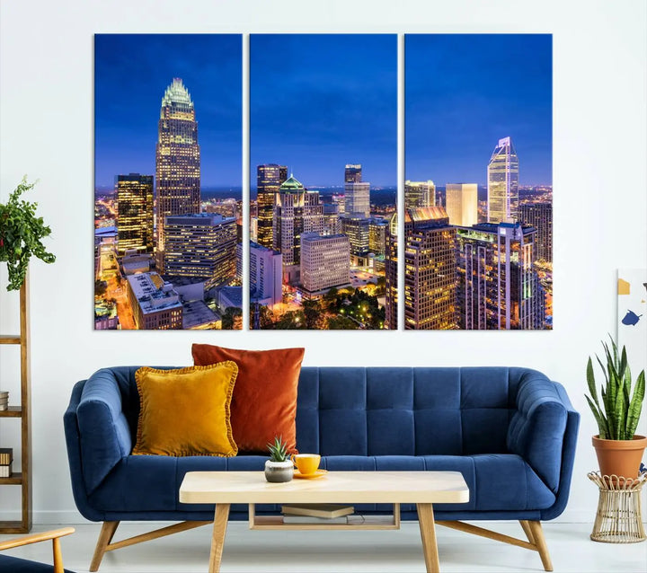 The living room features the "Charlotte City Lights Night Blue Skyline Cityscape View Wall Art Canvas Print" on museum-quality canvas with a UV-protective coating. Cozy and modern decor complements the ready-to-hang look.