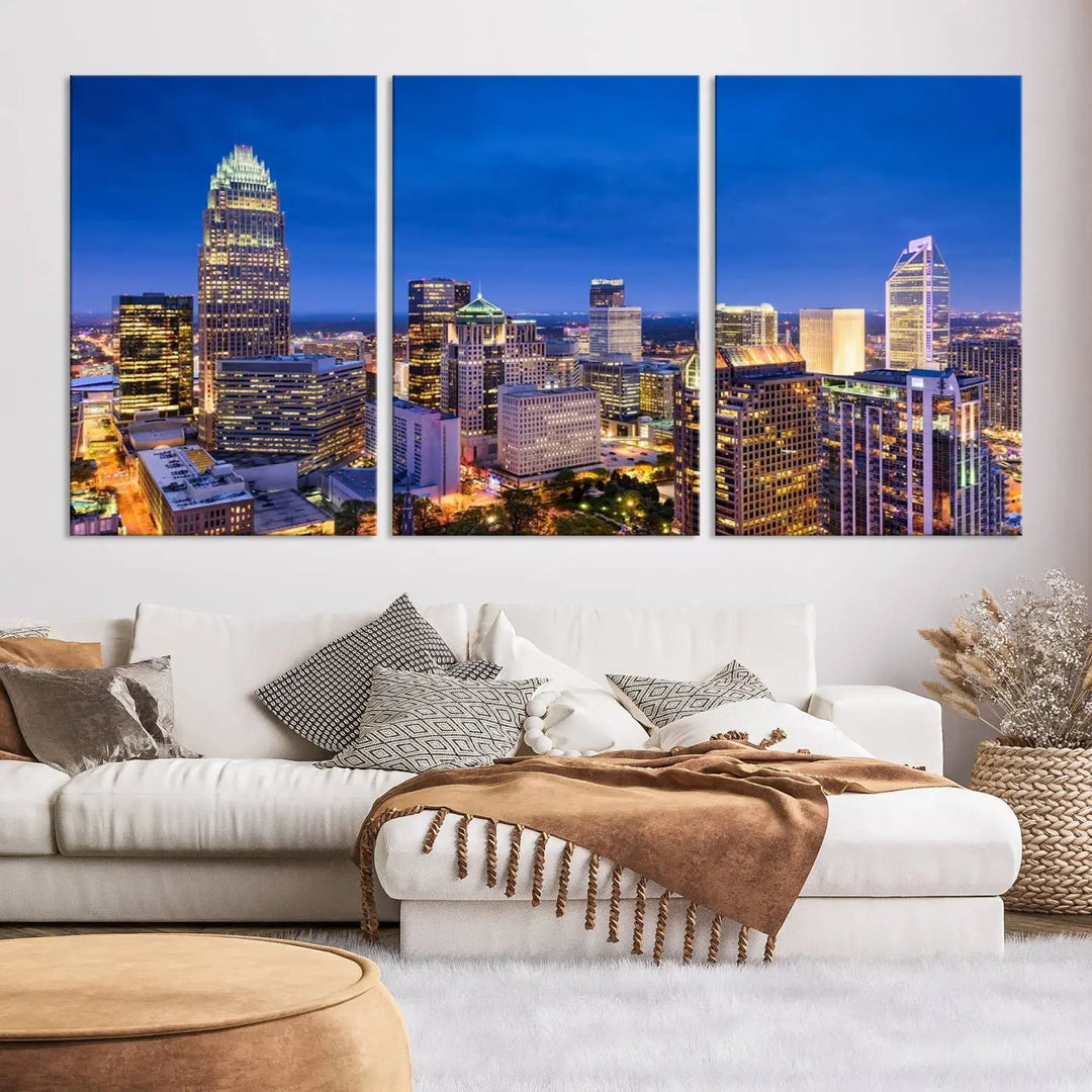 The living room features the "Charlotte City Lights Night Blue Skyline Cityscape View Wall Art Canvas Print" on museum-quality canvas with a UV-protective coating. Cozy and modern decor complements the ready-to-hang look.