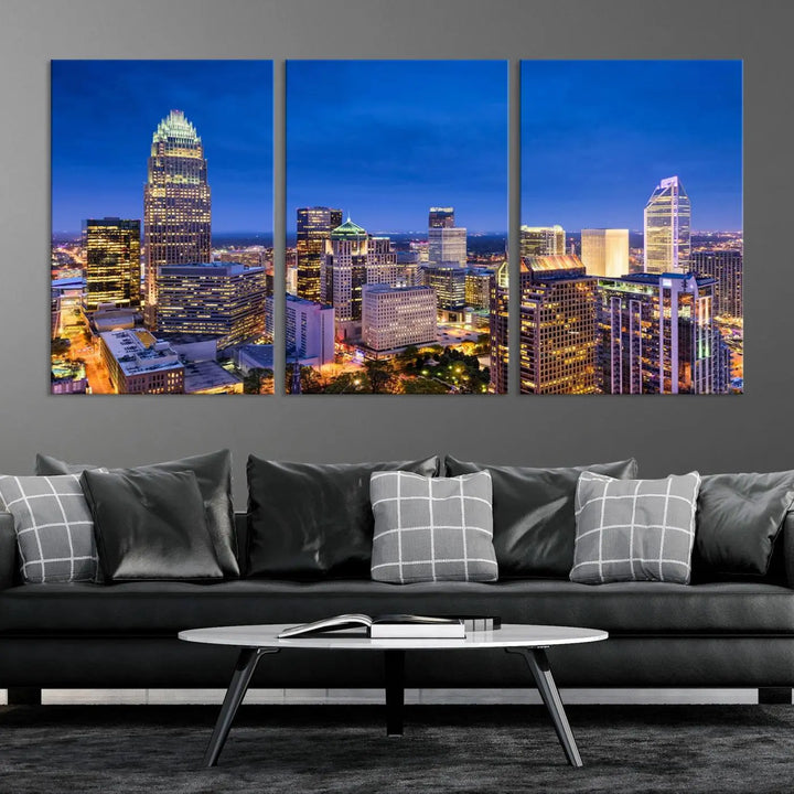 The living room features the "Charlotte City Lights Night Blue Skyline Cityscape View Wall Art Canvas Print" on museum-quality canvas with a UV-protective coating. Cozy and modern decor complements the ready-to-hang look.