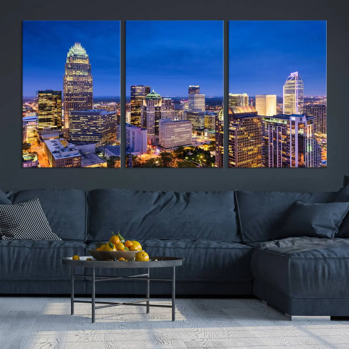 The living room features the "Charlotte City Lights Night Blue Skyline Cityscape View Wall Art Canvas Print" on museum-quality canvas with a UV-protective coating. Cozy and modern decor complements the ready-to-hang look.