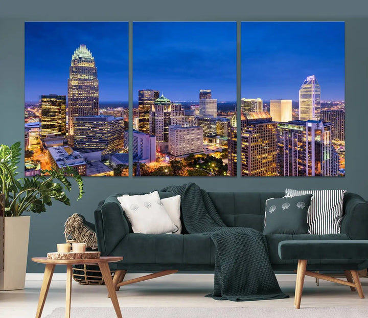 The living room features the "Charlotte City Lights Night Blue Skyline Cityscape View Wall Art Canvas Print" on museum-quality canvas with a UV-protective coating. Cozy and modern decor complements the ready-to-hang look.