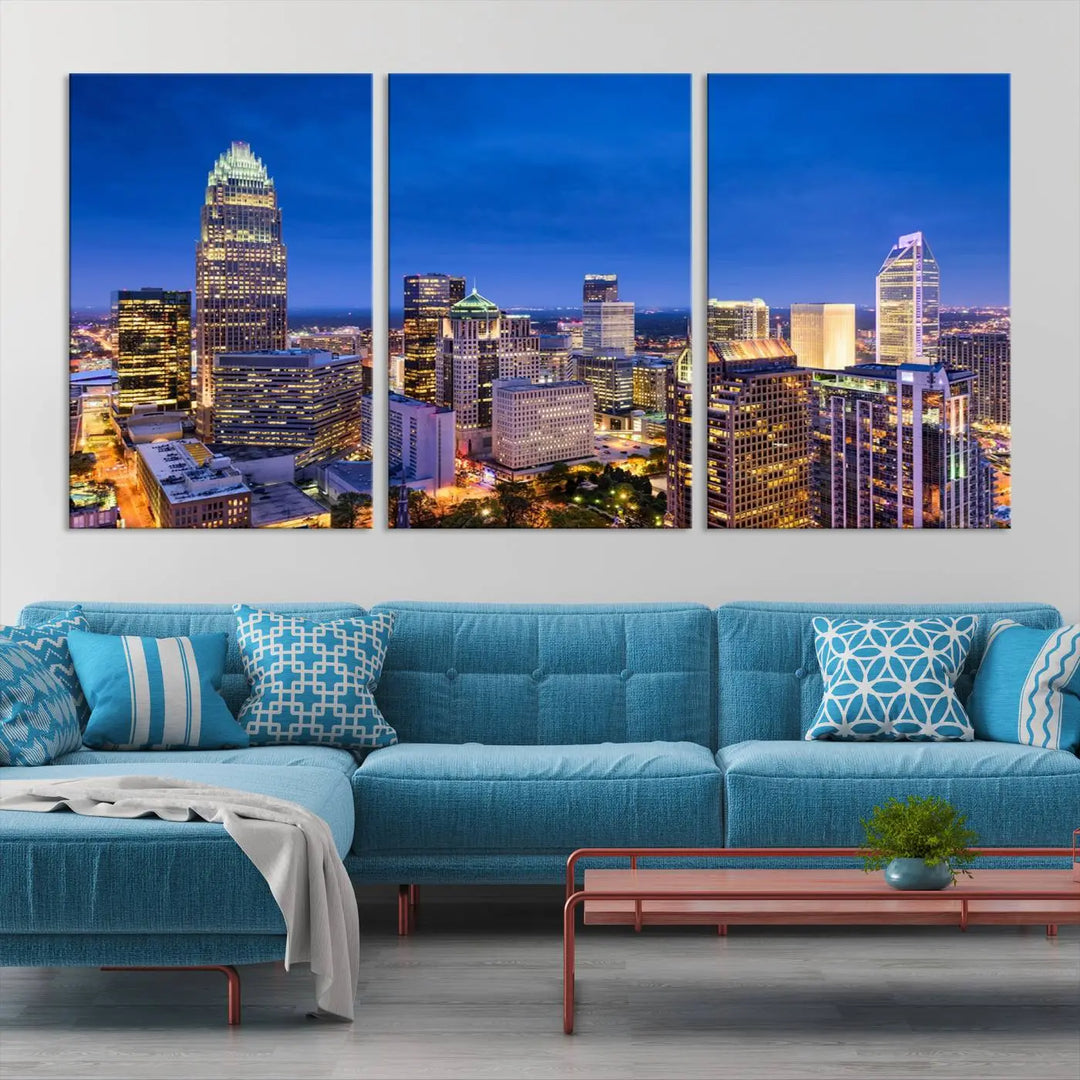 The living room features the "Charlotte City Lights Night Blue Skyline Cityscape View Wall Art Canvas Print" on museum-quality canvas with a UV-protective coating. Cozy and modern decor complements the ready-to-hang look.