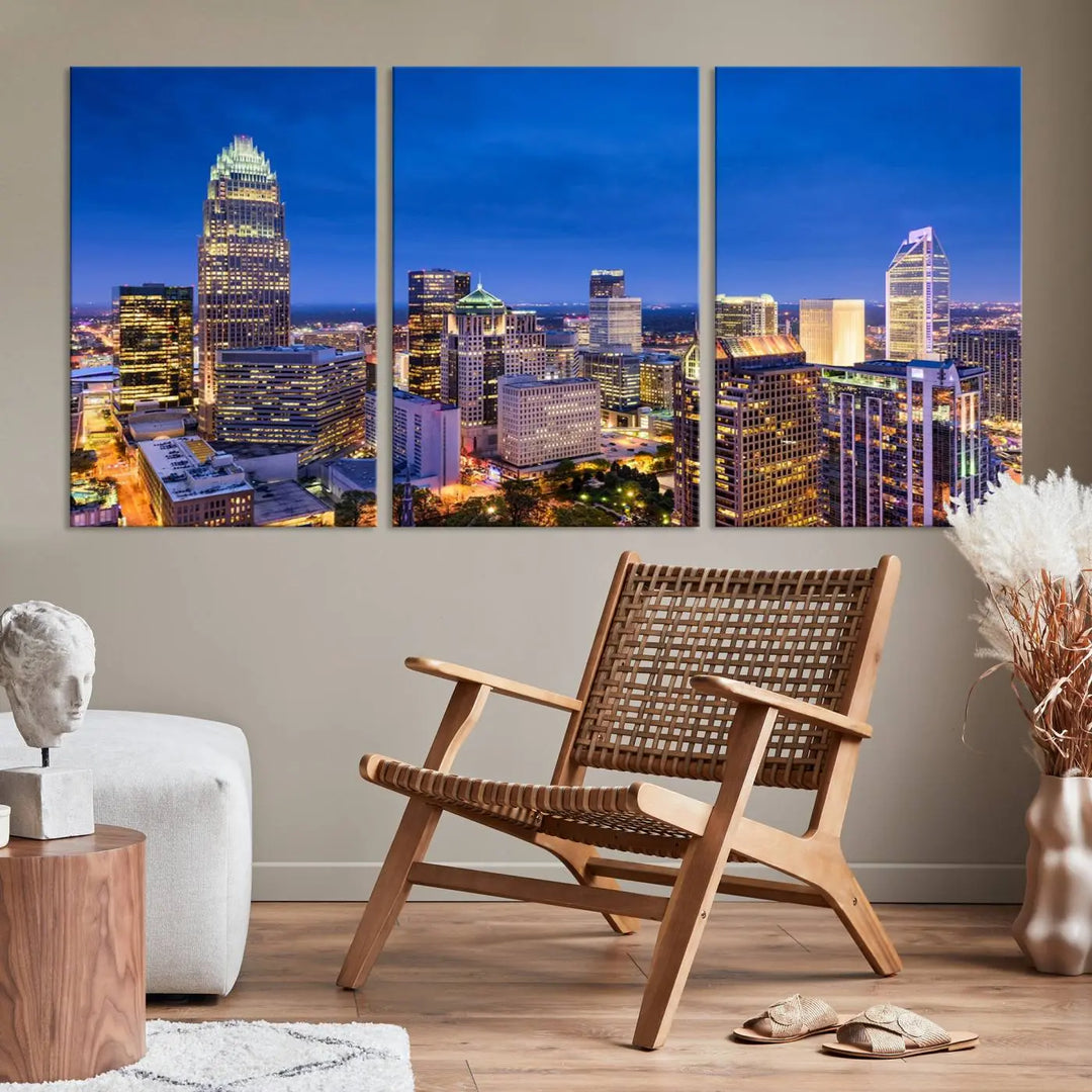 The living room features the "Charlotte City Lights Night Blue Skyline Cityscape View Wall Art Canvas Print" on museum-quality canvas with a UV-protective coating. Cozy and modern decor complements the ready-to-hang look.