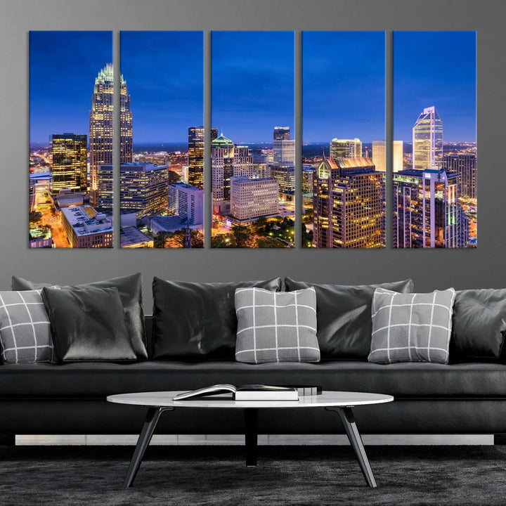 The living room features the "Charlotte City Lights Night Blue Skyline Cityscape View Wall Art Canvas Print" on museum-quality canvas with a UV-protective coating. Cozy and modern decor complements the ready-to-hang look.