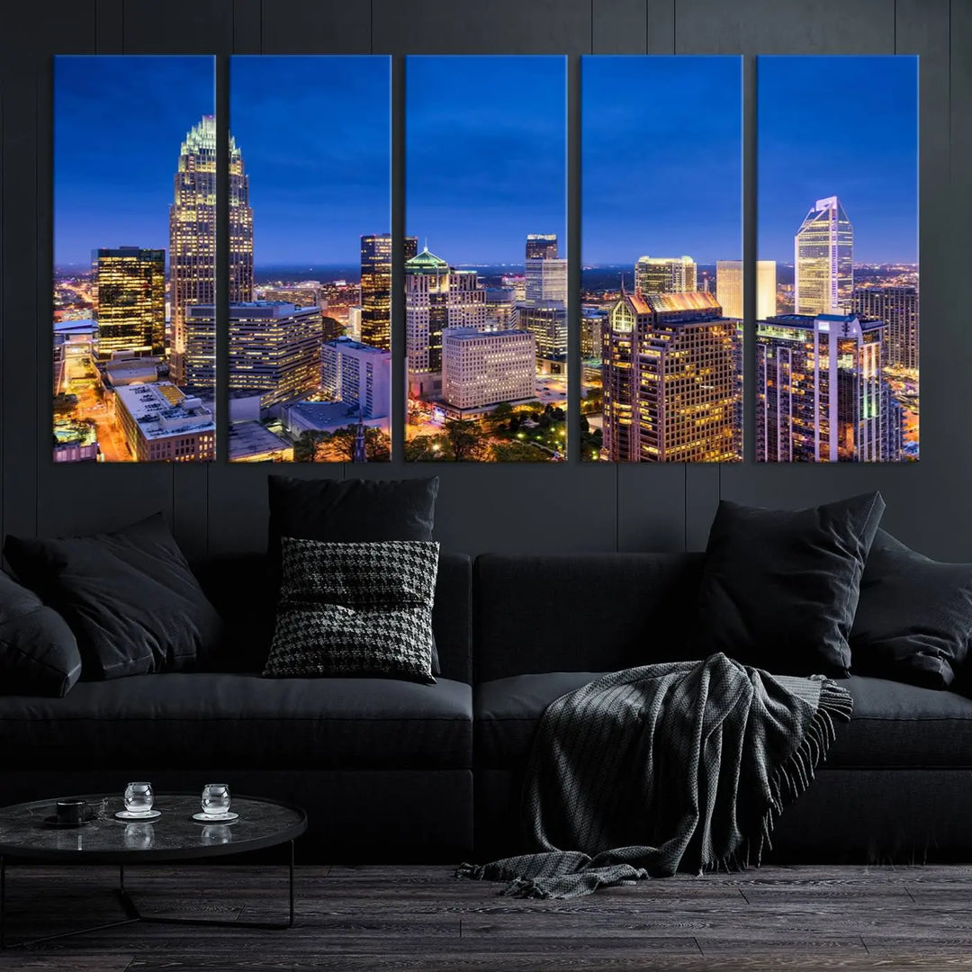 The living room features the "Charlotte City Lights Night Blue Skyline Cityscape View Wall Art Canvas Print" on museum-quality canvas with a UV-protective coating. Cozy and modern decor complements the ready-to-hang look.