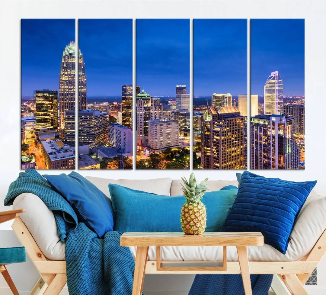 The living room features the "Charlotte City Lights Night Blue Skyline Cityscape View Wall Art Canvas Print" on museum-quality canvas with a UV-protective coating. Cozy and modern decor complements the ready-to-hang look.