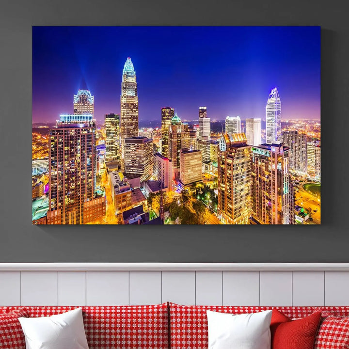 A modern living room features the Charlotte City Lights Night Blue Skyline Cityscape View wall art canvas print.