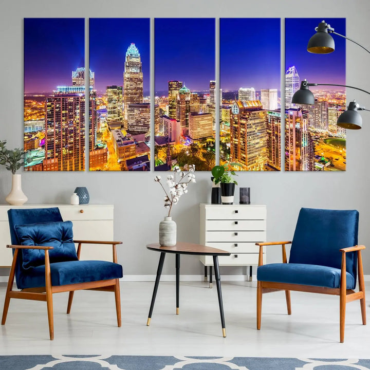 A modern living room features the Charlotte City Lights Night Blue Skyline Cityscape View wall art canvas print.