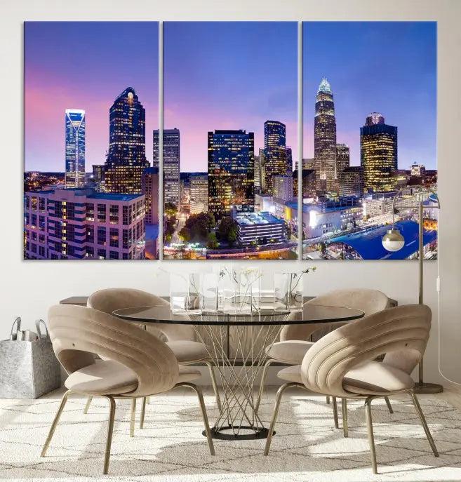 The Charlotte City Lights Sunset Purple Skyline Cityscape View Wall Art Canvas Print showcases a triptych of a city skyline with illuminated skyscrapers at dusk.