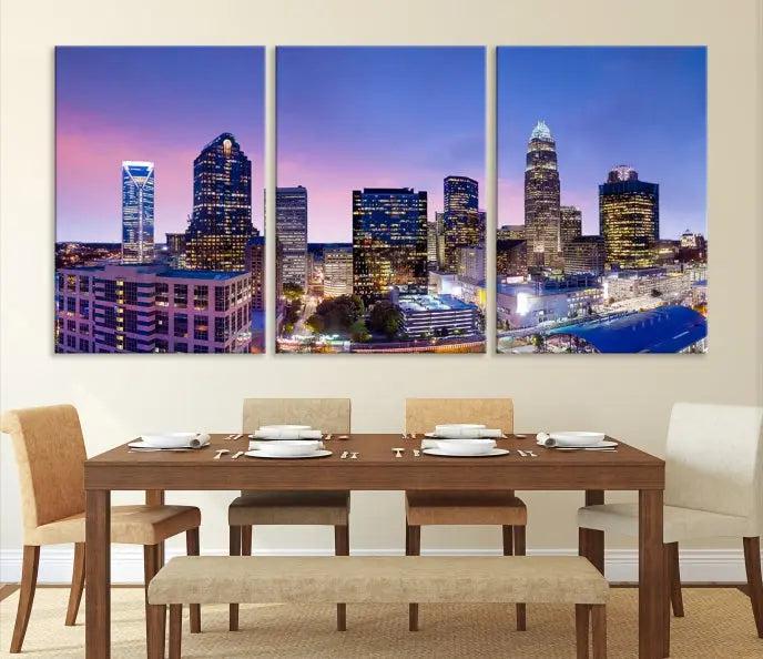 The Charlotte City Lights Sunset Purple Skyline Cityscape View Wall Art Canvas Print showcases a triptych of a city skyline with illuminated skyscrapers at dusk.