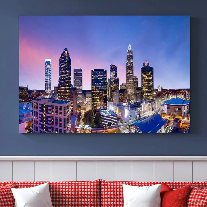 The living room features the "Charlotte City Lights Sunset Purple Skyline Cityscape View Wall Art Canvas Print," a mesmerizing depiction of a city skyline at sunset split into five panels on museum-quality canvas. This gallery-wrapped artwork is enhanced with a UV-protective coating, ensuring that its captivating colors stay vibrant for years.