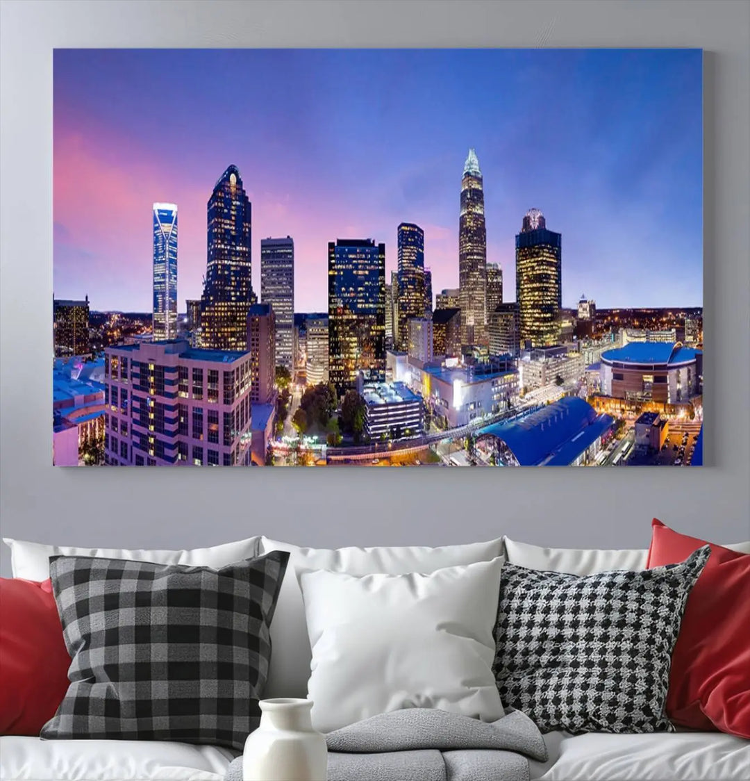 The living room features the "Charlotte City Lights Sunset Purple Skyline Cityscape View Wall Art Canvas Print," a mesmerizing depiction of a city skyline at sunset split into five panels on museum-quality canvas. This gallery-wrapped artwork is enhanced with a UV-protective coating, ensuring that its captivating colors stay vibrant for years.