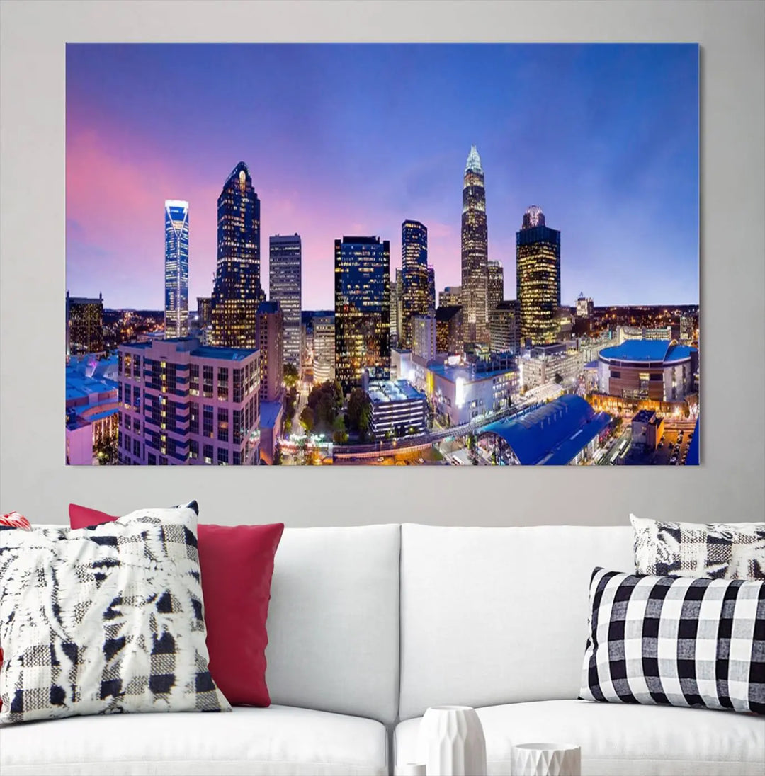 The living room features the "Charlotte City Lights Sunset Purple Skyline Cityscape View Wall Art Canvas Print," a mesmerizing depiction of a city skyline at sunset split into five panels on museum-quality canvas. This gallery-wrapped artwork is enhanced with a UV-protective coating, ensuring that its captivating colors stay vibrant for years.