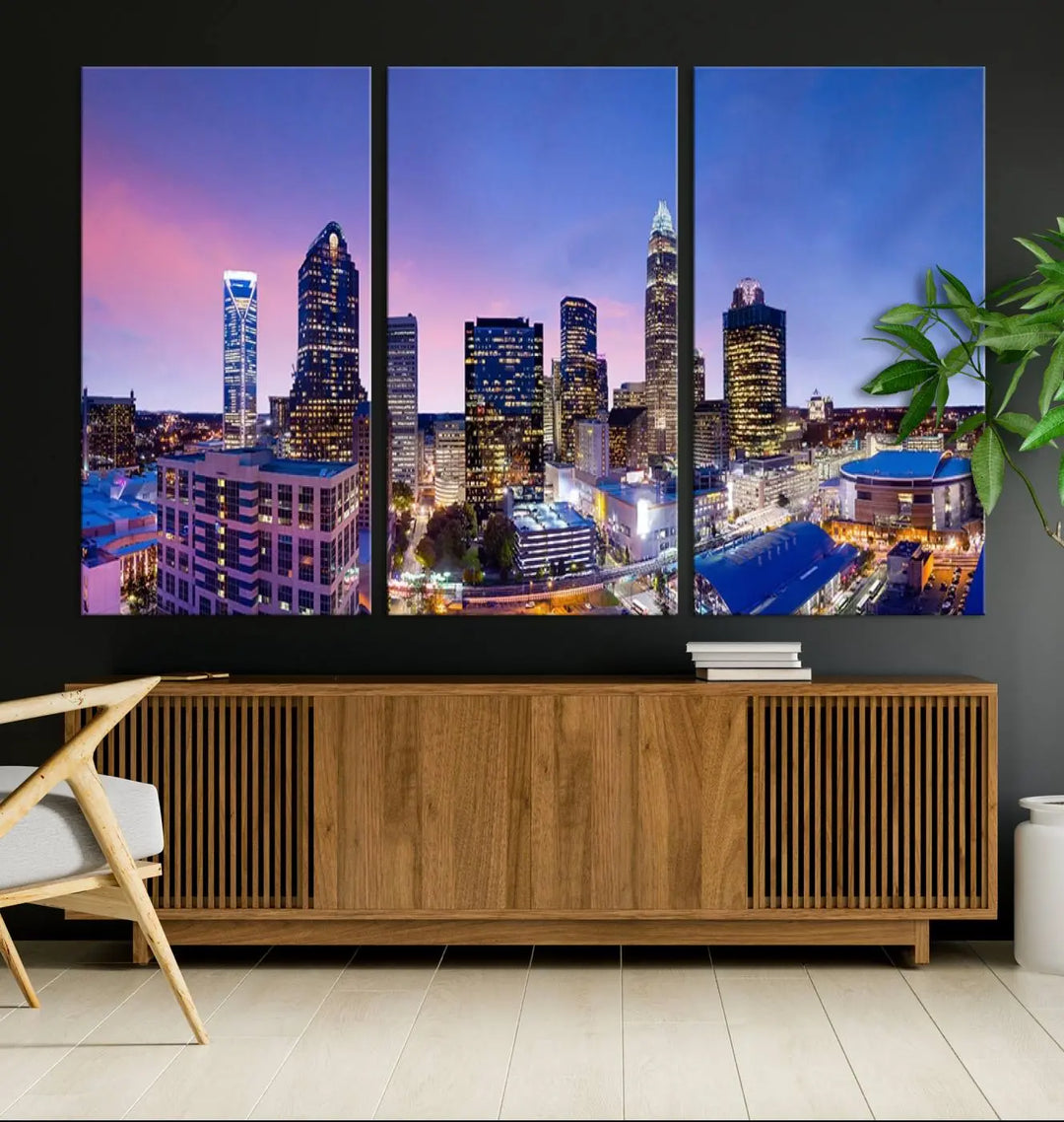 The living room features the "Charlotte City Lights Sunset Purple Skyline Cityscape View Wall Art Canvas Print," a mesmerizing depiction of a city skyline at sunset split into five panels on museum-quality canvas. This gallery-wrapped artwork is enhanced with a UV-protective coating, ensuring that its captivating colors stay vibrant for years.