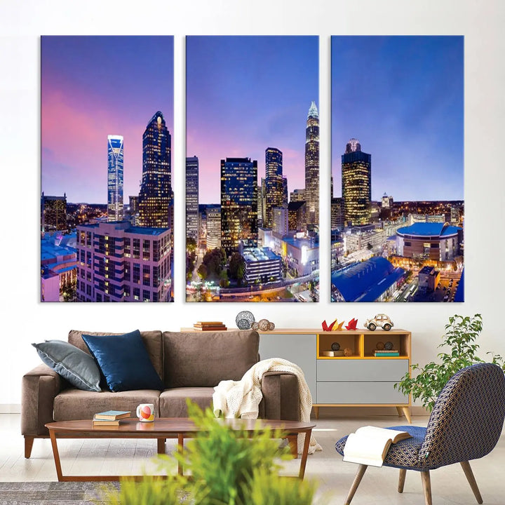 The living room features the "Charlotte City Lights Sunset Purple Skyline Cityscape View Wall Art Canvas Print," a mesmerizing depiction of a city skyline at sunset split into five panels on museum-quality canvas. This gallery-wrapped artwork is enhanced with a UV-protective coating, ensuring that its captivating colors stay vibrant for years.