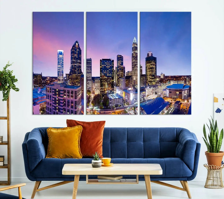 The living room features the "Charlotte City Lights Sunset Purple Skyline Cityscape View Wall Art Canvas Print," a mesmerizing depiction of a city skyline at sunset split into five panels on museum-quality canvas. This gallery-wrapped artwork is enhanced with a UV-protective coating, ensuring that its captivating colors stay vibrant for years.