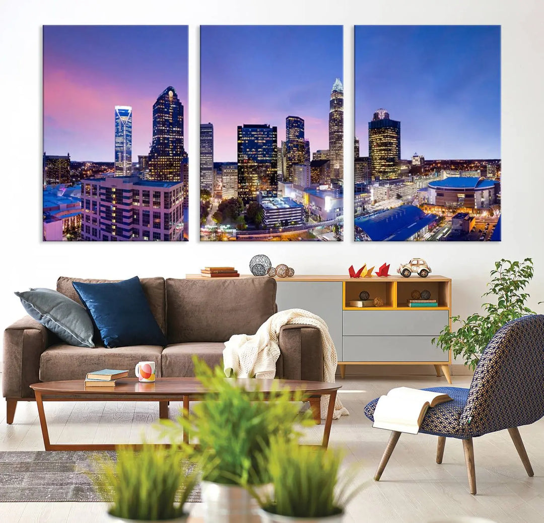 The living room features the "Charlotte City Lights Sunset Purple Skyline Cityscape View Wall Art Canvas Print," a mesmerizing depiction of a city skyline at sunset split into five panels on museum-quality canvas. This gallery-wrapped artwork is enhanced with a UV-protective coating, ensuring that its captivating colors stay vibrant for years.