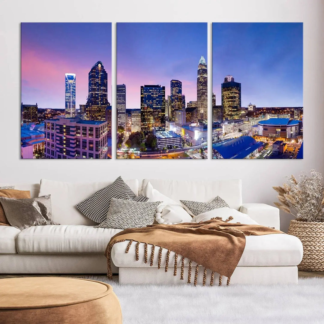 The living room features the "Charlotte City Lights Sunset Purple Skyline Cityscape View Wall Art Canvas Print," a mesmerizing depiction of a city skyline at sunset split into five panels on museum-quality canvas. This gallery-wrapped artwork is enhanced with a UV-protective coating, ensuring that its captivating colors stay vibrant for years.