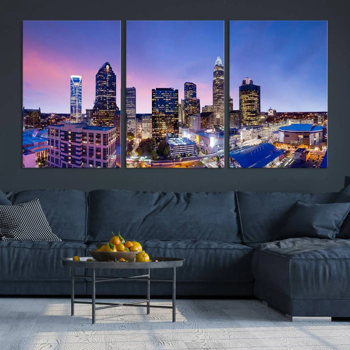 The living room features the "Charlotte City Lights Sunset Purple Skyline Cityscape View Wall Art Canvas Print," a mesmerizing depiction of a city skyline at sunset split into five panels on museum-quality canvas. This gallery-wrapped artwork is enhanced with a UV-protective coating, ensuring that its captivating colors stay vibrant for years.