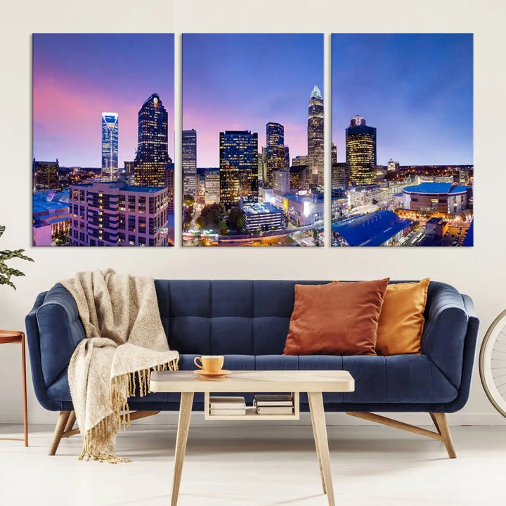 The living room features the "Charlotte City Lights Sunset Purple Skyline Cityscape View Wall Art Canvas Print," a mesmerizing depiction of a city skyline at sunset split into five panels on museum-quality canvas. This gallery-wrapped artwork is enhanced with a UV-protective coating, ensuring that its captivating colors stay vibrant for years.