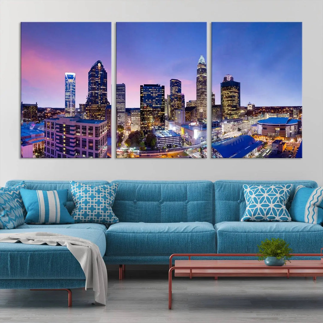 The living room features the "Charlotte City Lights Sunset Purple Skyline Cityscape View Wall Art Canvas Print," a mesmerizing depiction of a city skyline at sunset split into five panels on museum-quality canvas. This gallery-wrapped artwork is enhanced with a UV-protective coating, ensuring that its captivating colors stay vibrant for years.