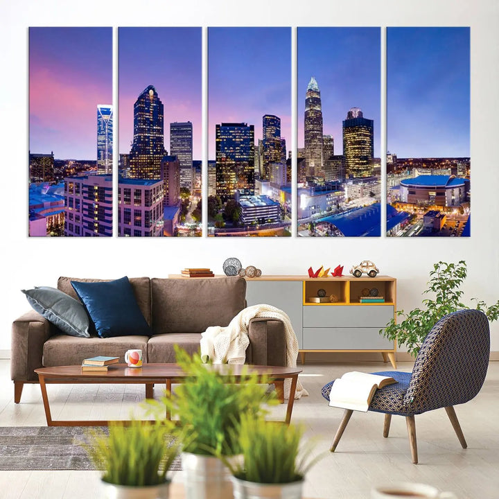 The living room features the "Charlotte City Lights Sunset Purple Skyline Cityscape View Wall Art Canvas Print," a mesmerizing depiction of a city skyline at sunset split into five panels on museum-quality canvas. This gallery-wrapped artwork is enhanced with a UV-protective coating, ensuring that its captivating colors stay vibrant for years.