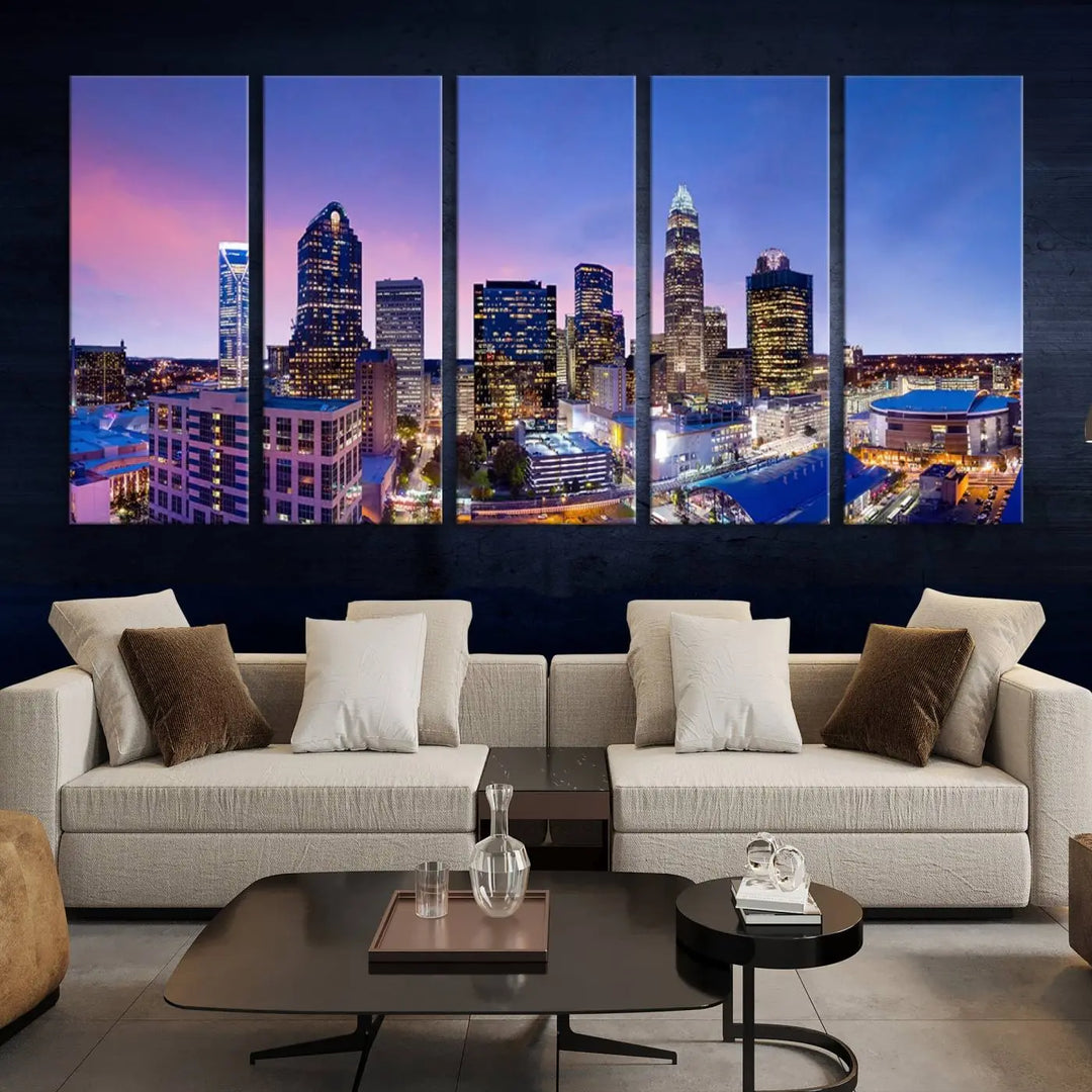 The living room features the "Charlotte City Lights Sunset Purple Skyline Cityscape View Wall Art Canvas Print," a mesmerizing depiction of a city skyline at sunset split into five panels on museum-quality canvas. This gallery-wrapped artwork is enhanced with a UV-protective coating, ensuring that its captivating colors stay vibrant for years.