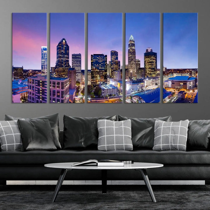 The living room features the "Charlotte City Lights Sunset Purple Skyline Cityscape View Wall Art Canvas Print," a mesmerizing depiction of a city skyline at sunset split into five panels on museum-quality canvas. This gallery-wrapped artwork is enhanced with a UV-protective coating, ensuring that its captivating colors stay vibrant for years.