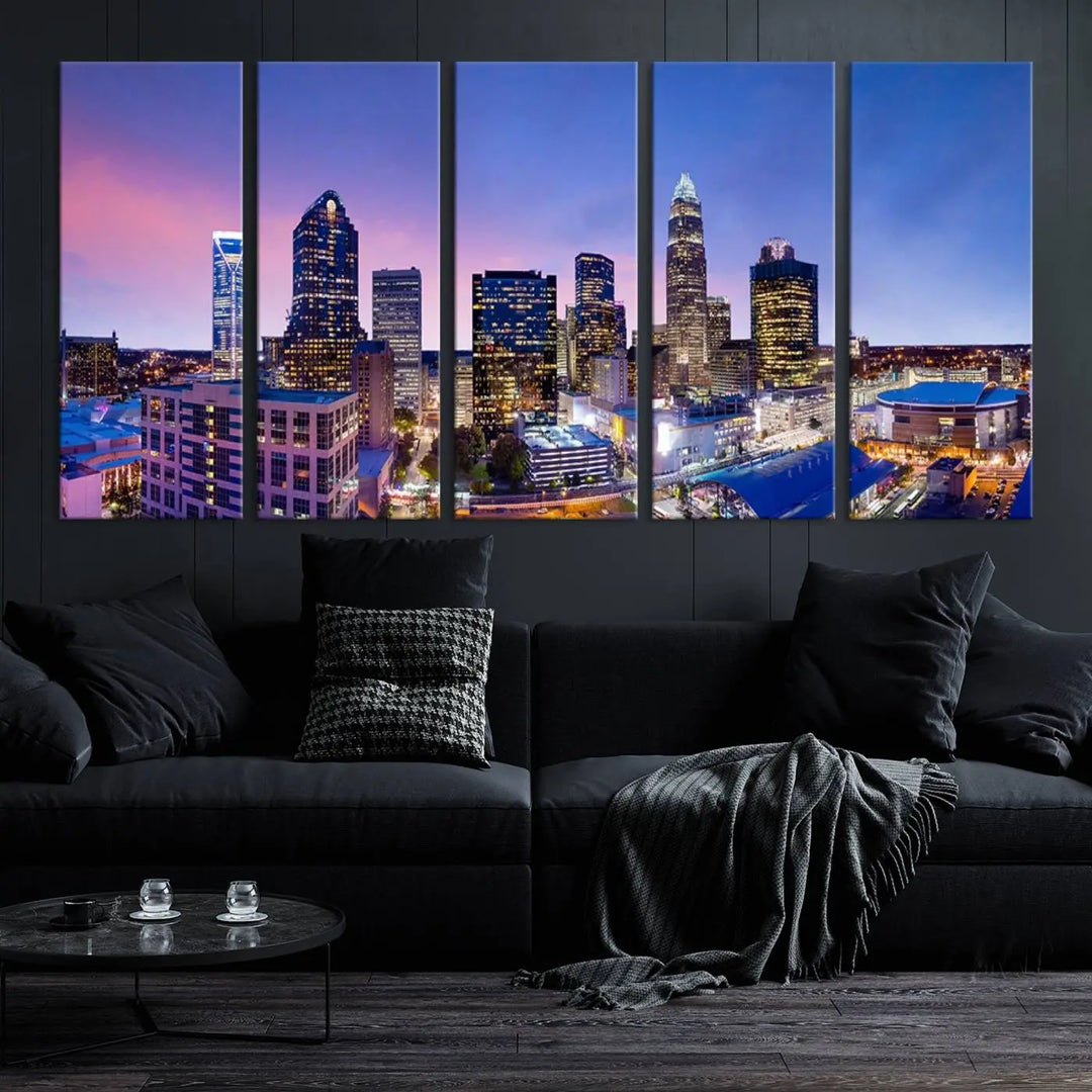 The living room features the "Charlotte City Lights Sunset Purple Skyline Cityscape View Wall Art Canvas Print," a mesmerizing depiction of a city skyline at sunset split into five panels on museum-quality canvas. This gallery-wrapped artwork is enhanced with a UV-protective coating, ensuring that its captivating colors stay vibrant for years.