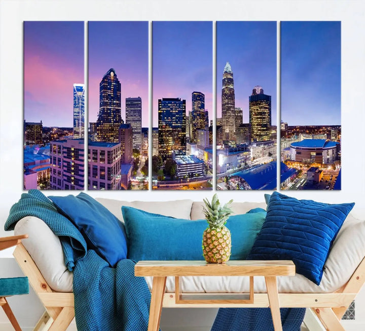 The living room features the "Charlotte City Lights Sunset Purple Skyline Cityscape View Wall Art Canvas Print," a mesmerizing depiction of a city skyline at sunset split into five panels on museum-quality canvas. This gallery-wrapped artwork is enhanced with a UV-protective coating, ensuring that its captivating colors stay vibrant for years.