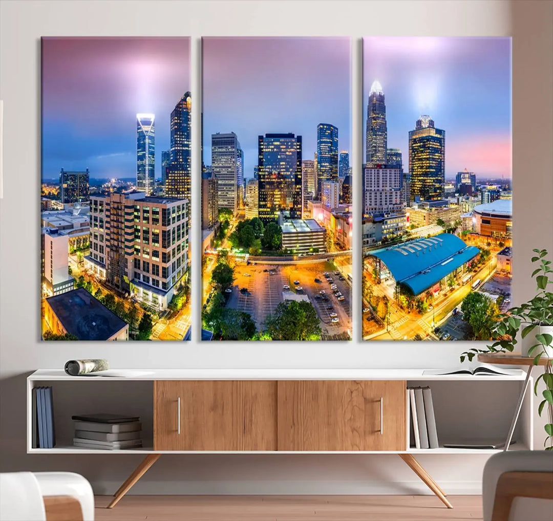 The "Charlotte City Lights Sunset Purple Skyline Cityscape View Wall Art Canvas Print" features a triptych of a vibrant city skyline at dusk, highlighting illuminated skyscrapers and urban streets. This artwork is crafted on museum-quality polycotton canvas, with its gallery-wrapped design ensuring durability and visual appeal for years to come.