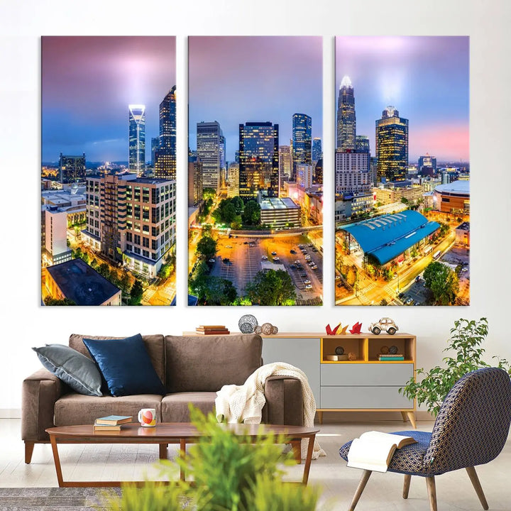 The "Charlotte City Lights Sunset Purple Skyline Cityscape View Wall Art Canvas Print" features a triptych of a vibrant city skyline at dusk, highlighting illuminated skyscrapers and urban streets. This artwork is crafted on museum-quality polycotton canvas, with its gallery-wrapped design ensuring durability and visual appeal for years to come.